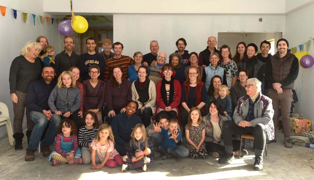 “We did it!” Treehouse Village celebrates the completion of our eco-friendly, multi-age cohousing development